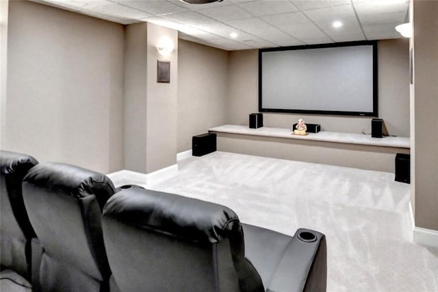 carpeted home theater room with baseboards, recessed lighting, and a drop ceiling