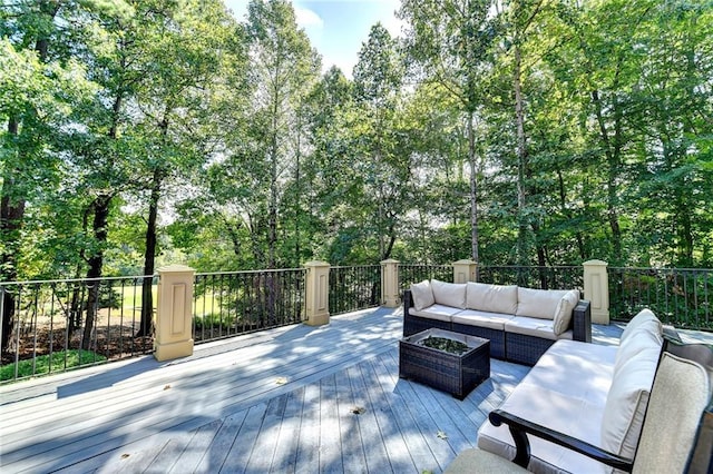 wooden terrace featuring outdoor lounge area
