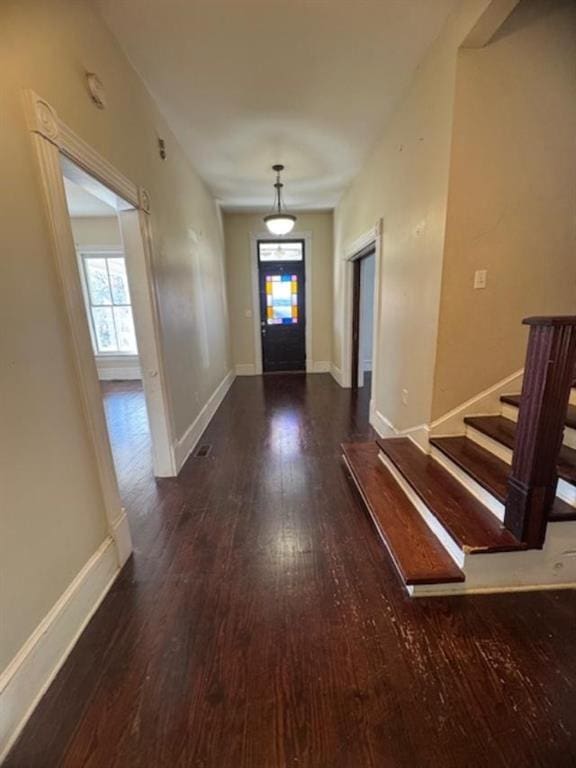 foyer entrance featuring dark hardwood / wood-style floors