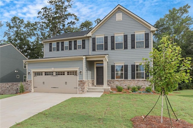 view of front facade featuring a garage and a front yard