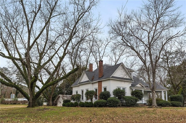 view of home's exterior with a lawn