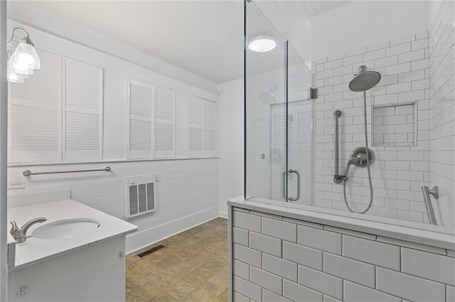 bathroom with vanity and walk in shower