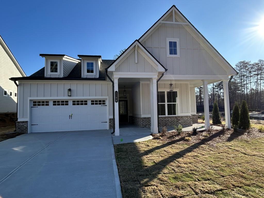 modern inspired farmhouse with covered porch