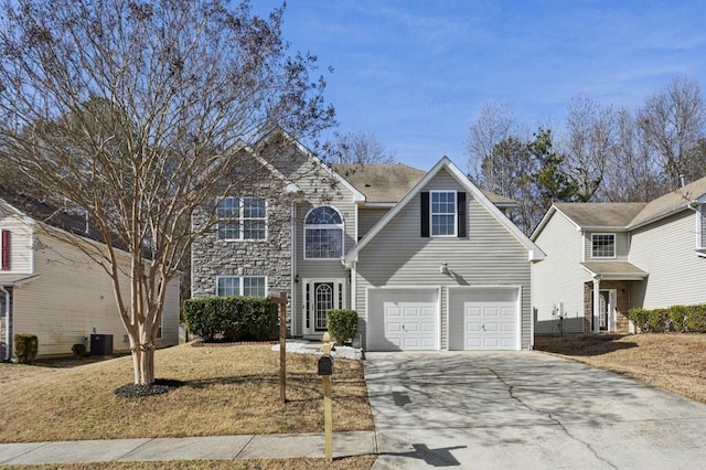 front of property with a garage and central AC