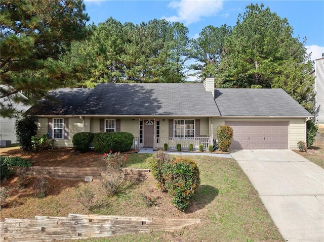 ranch-style home featuring a porch and a garage