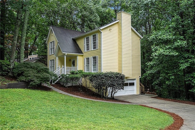 1879 Beaver Dam Ln NE, Marietta, GA 30062 - view of front of home with asphalt driveway, a chimney, a garage, a front yard, and a porch