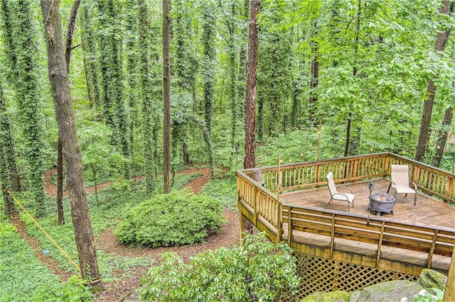 1879 Beaver Dam Ln NE, Marietta, GA 30062 - wooden terrace with an outdoor fire pit and a wooded view
