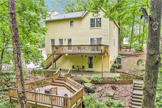 1879 Beaver Dam Ln NE, Marietta, GA 30062 - rear view of house with a deck, stairs, and a patio
