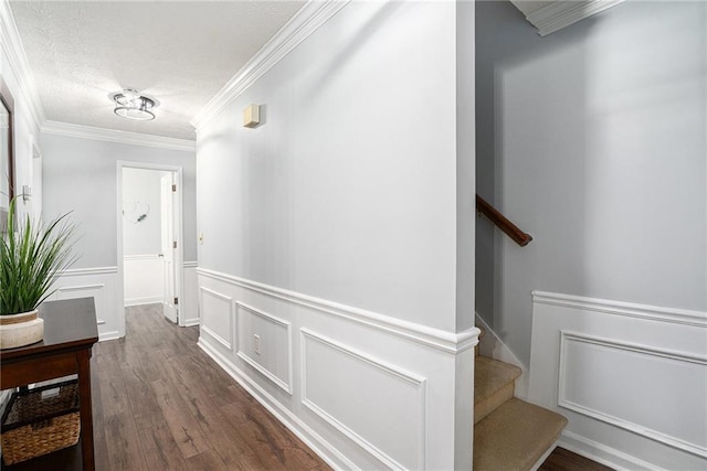 1879 Beaver Dam Ln NE, Marietta, GA 30062 - hall featuring crown molding, a decorative wall, wood finished floors, a wainscoted wall, and stairway