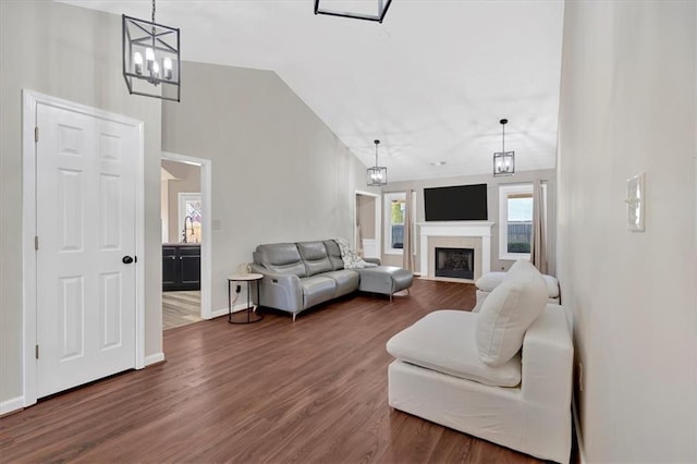 living room featuring dark hardwood / wood-style flooring, high vaulted ceiling, and sink