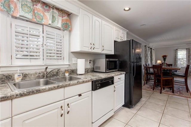 kitchen with crown molding, light tile patterned floors, white dishwasher, sink, and white cabinetry