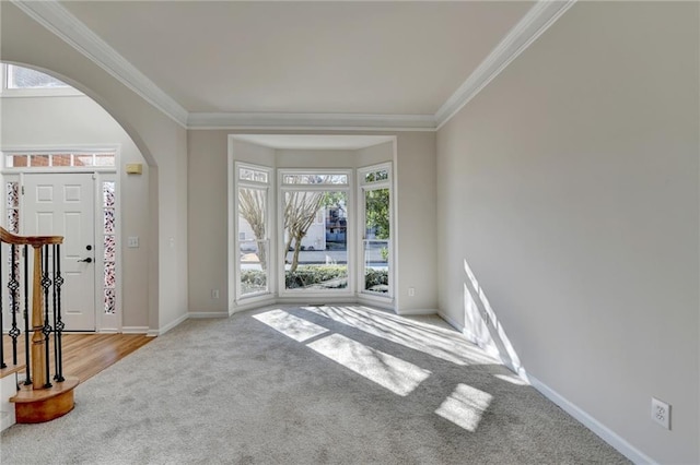 1924 Wilkenson Xing, Marietta, GA 30066 - carpeted foyer featuring arched walkways, ornamental molding, healthy amount of natural light, and baseboards