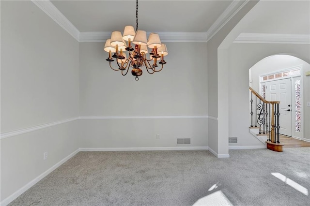 1924 Wilkenson Xing, Marietta, GA 30066 - carpeted spare room featuring a chandelier, arched walkways, crown molding, stairway, and baseboards
