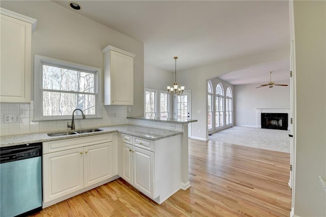 1924 Wilkenson Xing, Marietta, GA 30066 - kitchen with dishwasher, a sink, a peninsula, and light wood-style floors