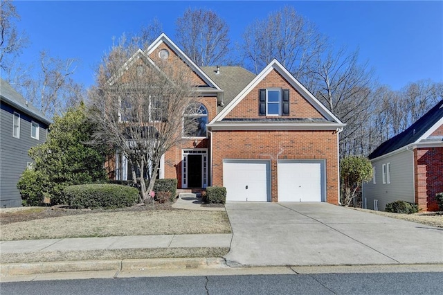 1924 Wilkenson Xing, Marietta, GA 30066 - traditional-style home with brick siding, an attached garage, and driveway