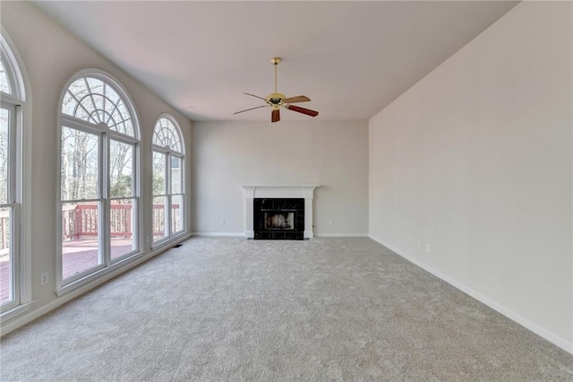 1924 Wilkenson Xing, Marietta, GA 30066 - unfurnished living room with a ceiling fan, carpet flooring, a high end fireplace, and baseboards