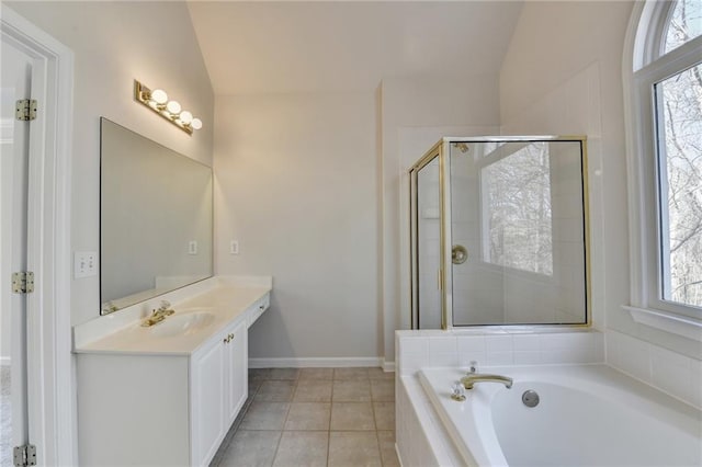 1924 Wilkenson Xing, Marietta, GA 30066 - bathroom featuring vaulted ceiling, a garden tub, vanity, a shower stall, and tile patterned flooring
