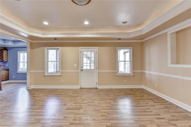 1924 Wilkenson Xing, Marietta, GA 30066 - foyer with a tray ceiling, crown molding, healthy amount of natural light, and light wood-style floors