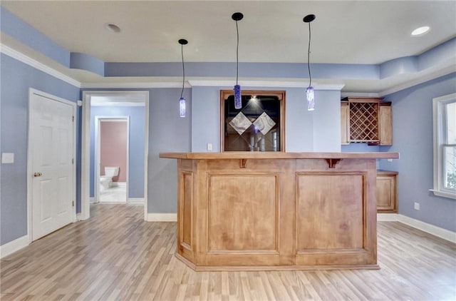 1924 Wilkenson Xing, Marietta, GA 30066 - indoor wet bar featuring baseboards, light wood-type flooring, hanging light fixtures, and a tray ceiling