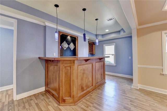 1924 Wilkenson Xing, Marietta, GA 30066 - indoor bar with light wood-style floors, baseboards, hanging light fixtures, crown molding, and a raised ceiling
