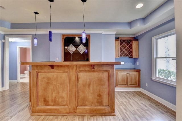 1924 Wilkenson Xing, Marietta, GA 30066 - indoor bar with light wood finished floors, baseboards, pendant lighting, and a raised ceiling