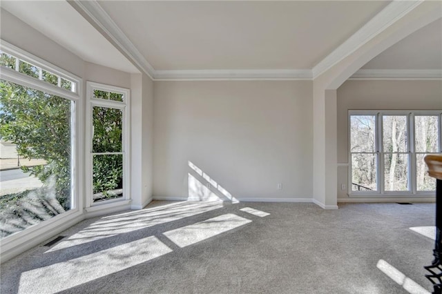 1924 Wilkenson Xing, Marietta, GA 30066 - carpeted empty room with plenty of natural light, ornamental molding, baseboards, and arched walkways
