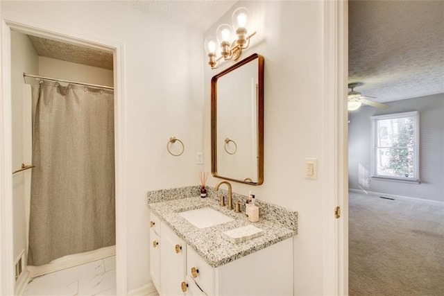 bathroom featuring a shower with shower curtain, a textured ceiling, vanity, and ceiling fan