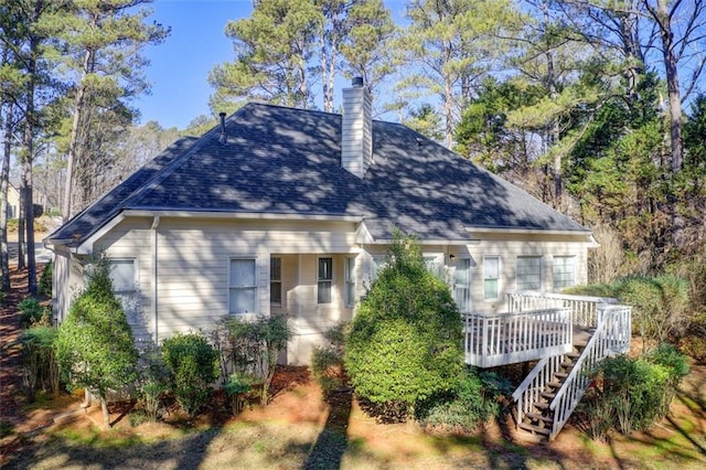 back of house with a wooden deck