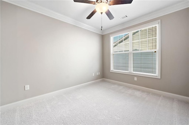 unfurnished room with visible vents, light carpet, ornamental molding, and baseboards