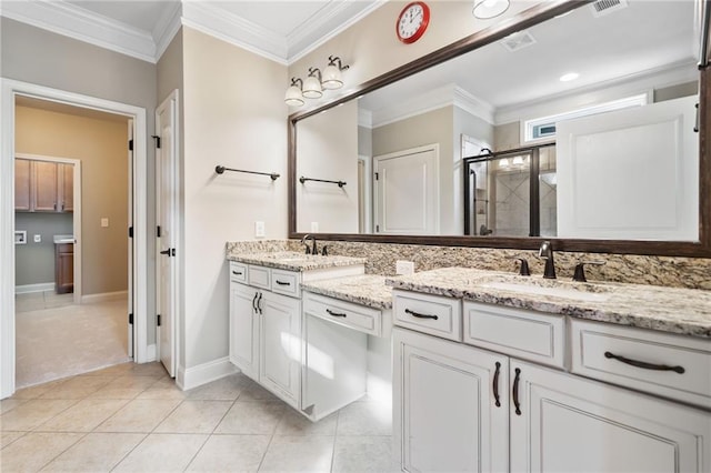 bathroom with a sink, a shower stall, tile patterned floors, double vanity, and ornamental molding