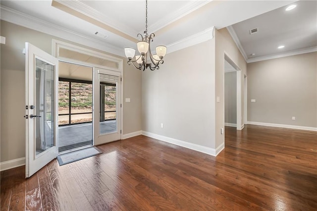 interior space with visible vents, a notable chandelier, wood-type flooring, and crown molding