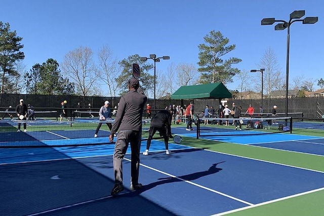 view of tennis court with fence