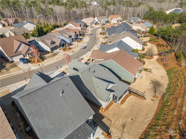 birds eye view of property with a residential view