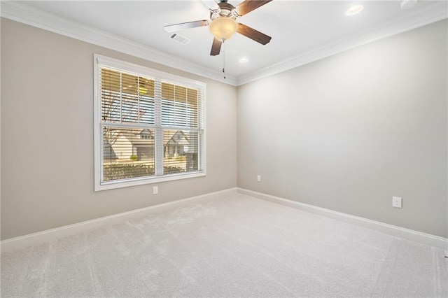 unfurnished room featuring ornamental molding, light colored carpet, and baseboards