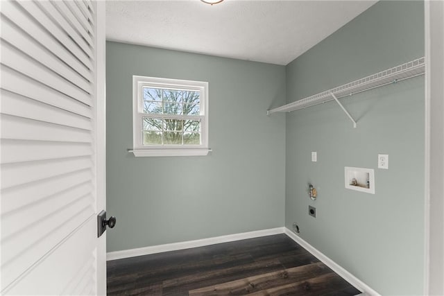 laundry area with dark wood-type flooring, washer hookup, and hookup for an electric dryer