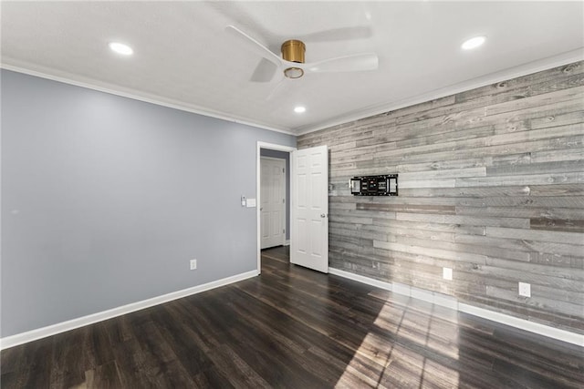 unfurnished room featuring dark hardwood / wood-style flooring, ornamental molding, and ceiling fan