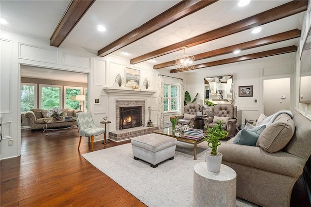 2080 Old Dominion Rd, Atlanta, GA 30350 - living area featuring a decorative wall, dark wood-type flooring, a brick fireplace, recessed lighting, and beam ceiling