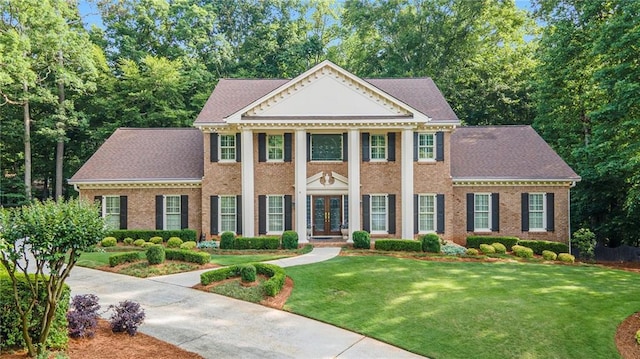 2080 Old Dominion Rd, Atlanta, GA 30350 - neoclassical / greek revival house with french doors, a front yard, and brick siding