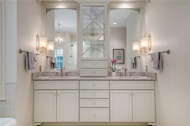 2080 Old Dominion Rd, Atlanta, GA 30350 - bathroom with double vanity and a chandelier
