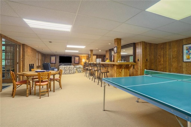 2080 Old Dominion Rd, Atlanta, GA 30350 - playroom with a paneled ceiling, wood walls, carpet flooring, and bar area