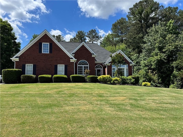 4530 Bogan Gates Dr, Buford, GA 30519 - view of front facade featuring brick siding and a front yard