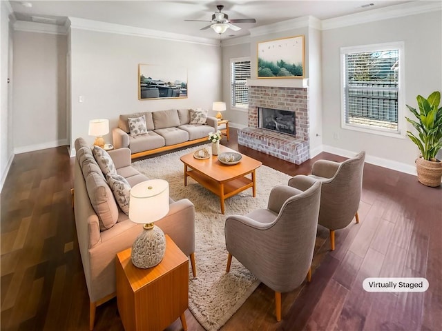 living room featuring a fireplace, dark hardwood / wood-style flooring, and a healthy amount of sunlight