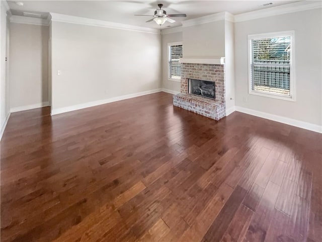 unfurnished living room with a fireplace, plenty of natural light, crown molding, and ceiling fan