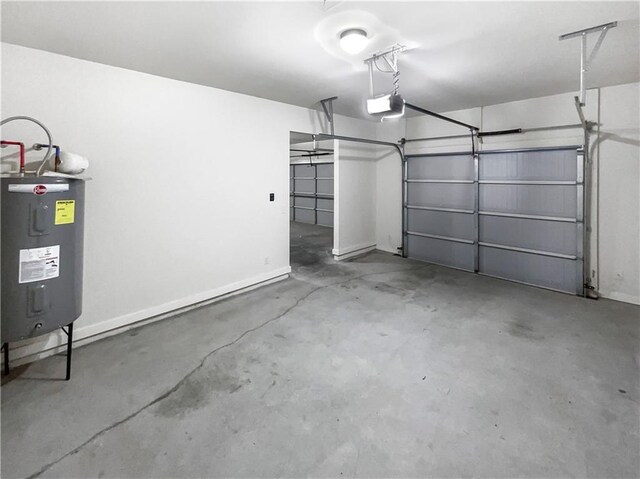 garage with electric water heater and a garage door opener