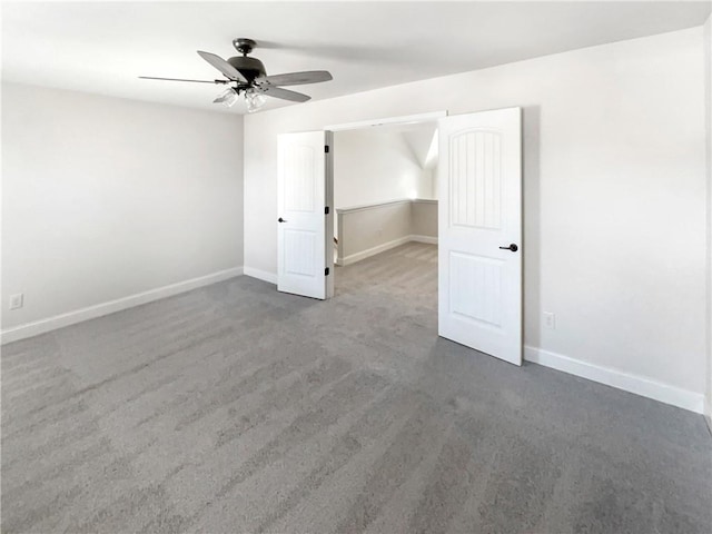 carpeted empty room featuring ceiling fan