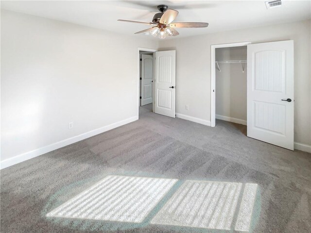 unfurnished bedroom with ceiling fan, a closet, and light colored carpet