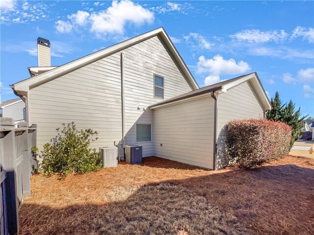 back of property featuring central AC unit