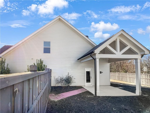 back of property with a patio