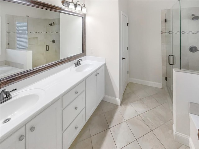 bathroom featuring vanity, tile patterned floors, and walk in shower