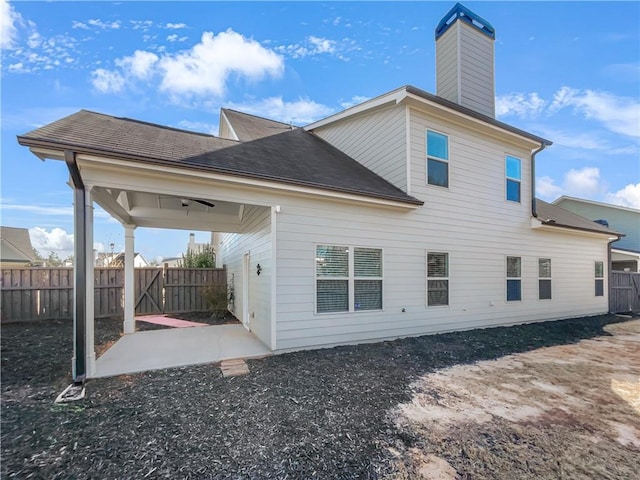 rear view of property featuring a patio